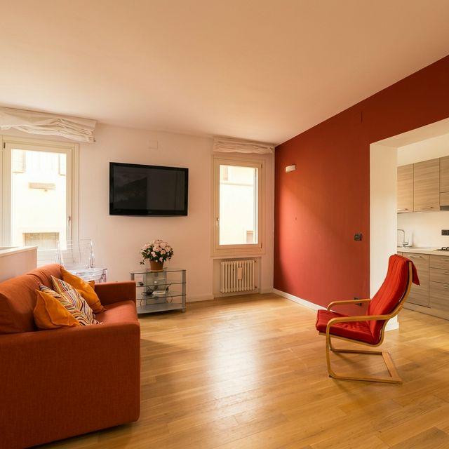 Living room with sofa and design armchair